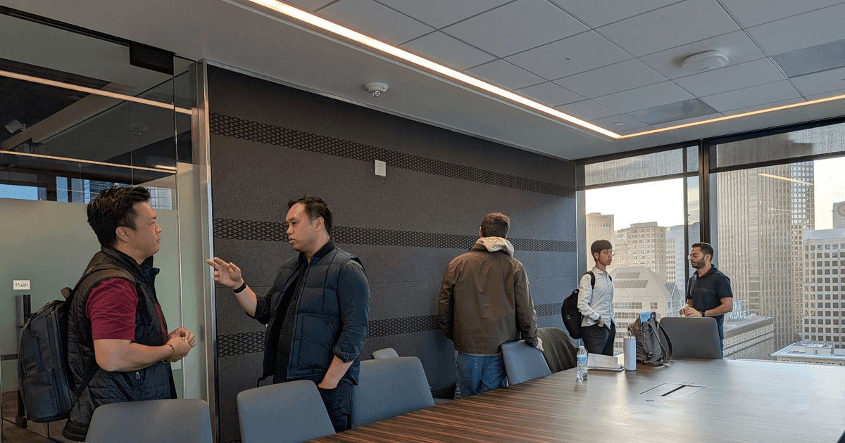 FounderNexus members talking in small groups after a speaker event